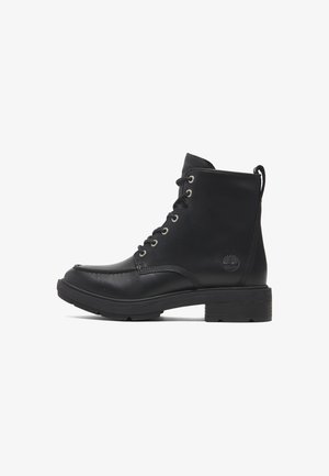 Black lace-up ankle boots with a smooth leather upper, round toe, metal eyelets, and a chunky black rubber sole; features a logo detail.