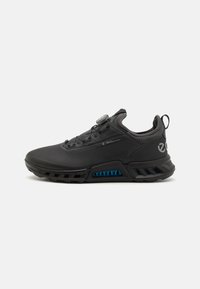 Black athletic shoes with a smooth material, featuring a rounded toe, textured upper, and a distinctive blue accent in the sole.