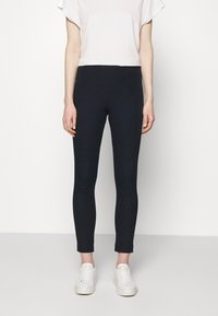 Navyblauwe, strakke leggings met een hoge tailleband, gemaakt van een rekbaar materiaal, met subtiele naden en een verkorte lengte.