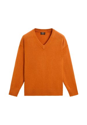 V-ringad tröja i stark orange, tillverkad av mjukt stickat material. Har ribbade ärmslut och nederkant samt en löst, avslappnad passform.