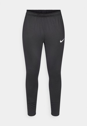 Črne športne legice iz gladkega, raztegljivega materiala. Imajo elastičen pas in bel Nikeov logotip na levi stegni.