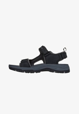 Sandalo da uomo nero e grigio scuro per attività all'aperto con cinturini regolabili in Velcro e suola robusta e testurizzata, adatta per escursioni o uso casual.