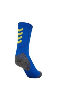 Blauwe sok met een gele chevronpatroon, grijze hiel en teen, en een geribbelde boord. Gemaakt van elastische stof voor comfort en ondersteuning.