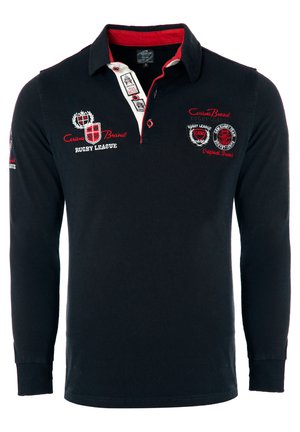 Langærmet rugbytrøje i marineblå bomuld med rød krave. Besluttet med broderede logoer og tekst på brystet og ærmerne. Regular fit.