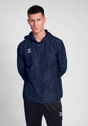 Hummel ESSENTIAL ALLWEATHER - Waterproof jacket - marine