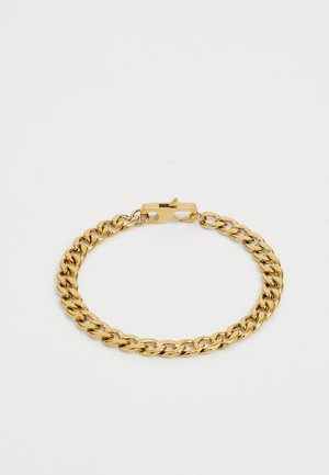 Bracelet en chaîne dorée avec des maillons épais, finition brillante et fermoir sécurisé. Texture lisse avec des formes arrondies uniformes.