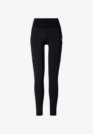 Czarne legginsy z wysokim stanem o dopasowanym kroju, z bocznymi kieszeniami i różowym zamkiem błyskawicznym na prawej udzie, przedstawione na białym tle.