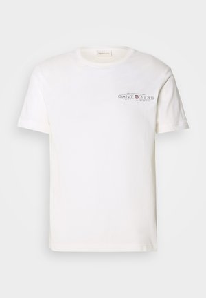 Hvit bomull t-skjorte med rund hals, korte ermer og trykket logo. Har minimalistisk design og avslappet passform.