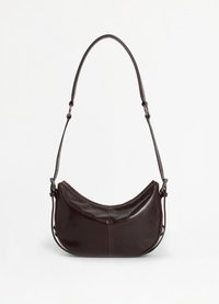Dark brown leather shoulder bag with a curved shape, adjustable strap, and smooth texture. Features a zip closure and minimal seams.