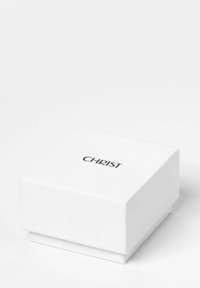 Weißer rechteckiger Kasten mit Deckel, mit einem schwarz bedruckten Logo "CHRIST" auf der Oberseite. Glatte Oberfläche, keine zusätzlichen Muster oder Akzente.