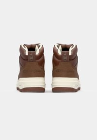 Brown high-top sneakers with a textured leather upper, cream accents, padded collar, and prominent logo on the heel. Rubber sole.