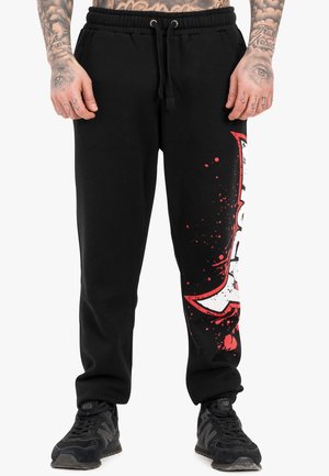 NORMALE PASSFORM SPLASHING JOGGER - Tracksuit bottoms - black red ecru
