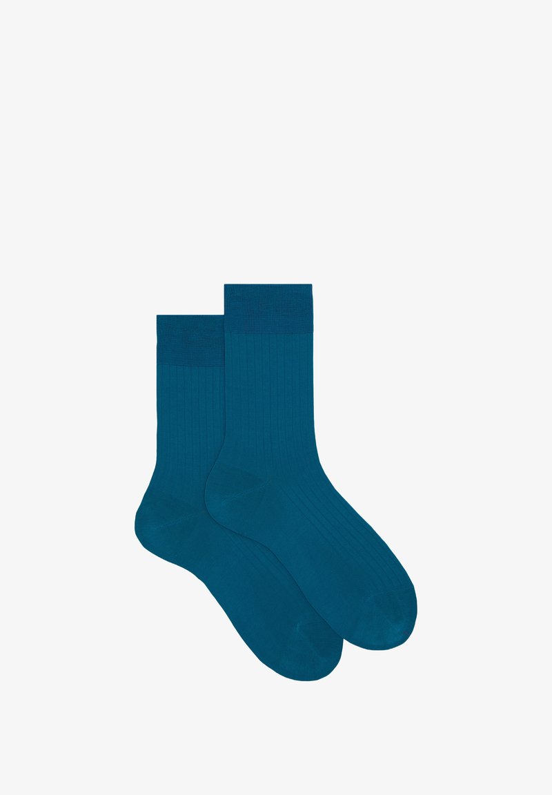 Türkise gerippte Socken in einer einfarbigen Ausführung mit einem strukturierten Bund und einer weichen, glatten Oberfläche, die für Komfort und den täglichen Gebrauch entworfen wurden.