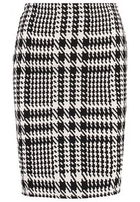 Svart och vit blyertskjol med ett hundtandsmönster och växlande geometriska former. Slätt tyg med resår i midjan.