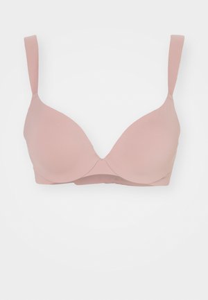 Soutien-gorge rose poudré en matériau lisse et extensible. Doté de baleines et de bonnets moulés, de bretelles ajustables et d'un design sans coutures.