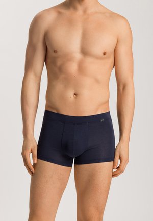 Navy blue boxers made from a soft fabric, featuring a fitted design, elastic waistband, and minimal stitching.