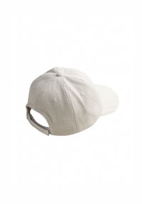 White herringbone-patterned cap with a rounded crown and a curved brim. Features an adjustable strap at the back for fit.
