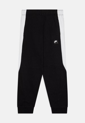 Nike Air trenirke v črni in beli barvi, z značko, elastičnim pasom, zoženimi nogami in mehkimi bombažnimi materiali.