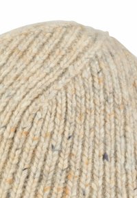 Beige knitted beanie with a textured pattern and subtle speckles of orange and blue. Soft wool material with a rounded top.