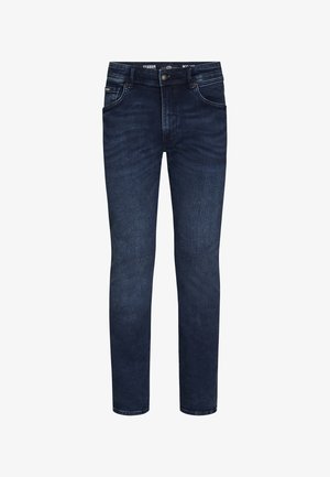 Jeans in denim blu scuro con vestibilità slim, caratterizzati da cinque tasche, hardware in ottone e dettagli di sfumature sottili sulle cosce.