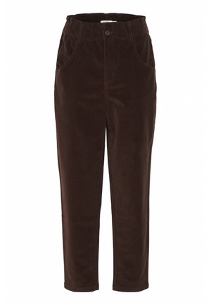 Braune Cord-Hosen mit elastischem Bund, zwei seitlichen Taschen und schmal zulaufendem Bein. Weiche Textur und warme Farbe.