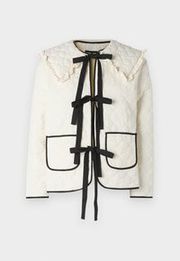 Μπεζ τριπλέτα μπουφάν με μαύρες λεπτομέρειες, με ριγέ κολάρο, δύο μπροστινές τσέπες και μαύρες κορδέλες για κλείσιμο.