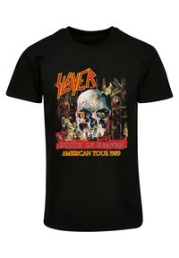 Black T-shirt featuring a skull graphic, "SLAYER" in yellow, and "SOUTH OF HEAVEN AMERICAN TOUR 1989" in red and yellow text, with intricate details.