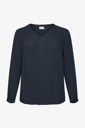 Long-sleeve navy blouse with a V-neck, featuring a relaxed cut and a textured fabric. Slightly rounded hem and minimal detailing at the neckline.
