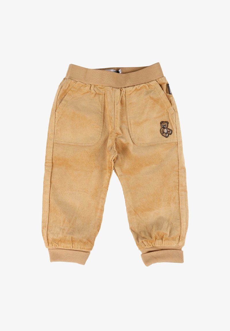 Pantaloni in corduroy marrone chiaro per bambini con vita elastica e polsini, tasche anteriori e una piccola toppa con orsetto sulla tasca destra.