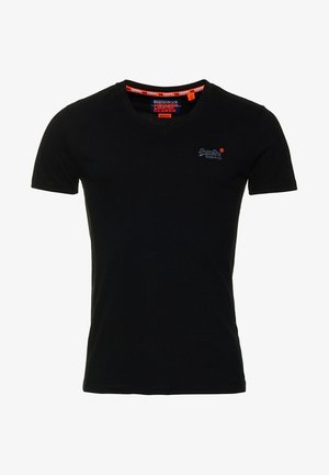 T-shirt en coton noir avec col rond, manches courtes et un petit logo brodé sur la poitrine. Tissu lisse avec une coupe ajustée.