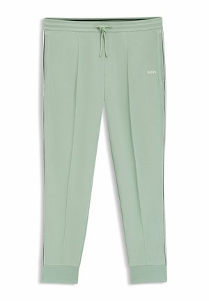 Pantalon de jogging vert clair avec taille à cordon de serrage, poches latérales, poignets côtelés et petit logo "BOSS" sur la cuisse supérieure.