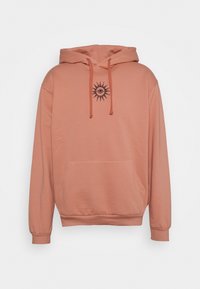 Felpa con cappuccio di colore rosa antico, con cappuccio regolabile, tasca frontale e emblema del sole nero sul petto. Tessuto morbido con polsini a coste.