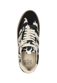 Black and cream cow-print sneaker with a textured upper, beige accents, and flat laces. Features a logo inside the shoe.