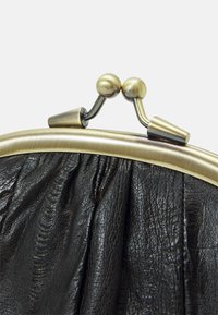 Black leather handbag with gathered texture, featuring a gold-toned metal frame and clasp closure with rounded accents.