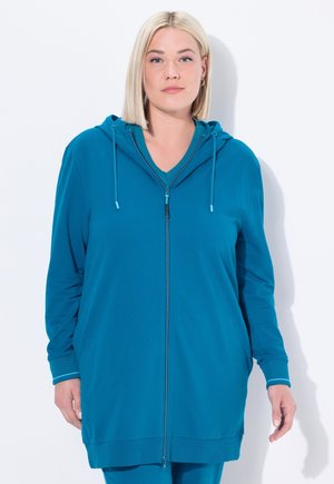 Teal zip-up hoodie van gladde stof, met een capuchon, geribbelde manchetten en een ontspannen pasvorm. Inclusief een diepe V-hals eronder.
