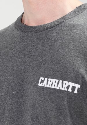 Grey cotton t-shirt with a round neckline, featuring a white "CARHARTT" print on the chest. Soft texture and casual fit.