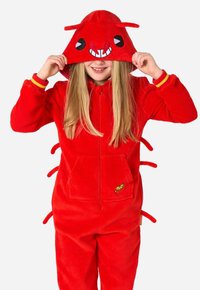 Rode, zachte onesie met een capuchon featuring een cartoongezicht, oversized ogen en antennes. Inclusief een voorzak en een citroentje als grafisch detail.