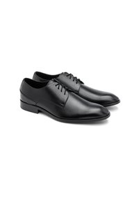 Fekete bőrből készült dresszcipők, hegyes orral, fűzős dizájnnal és sima felülettel. A talpak elegánsak és enyhén megemeltek.