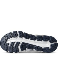 Suela de zapatilla de correr en azul marino oscuro y blanco. Presenta surcos profundos y goma texturizada para mayor tracción. Incluye un logo de la marca prominente en el lateral.