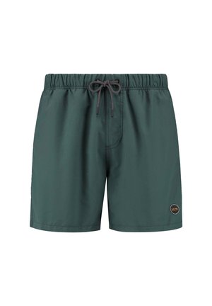 Bañador corto verde oscuro hecho de una tela ligera, con una cintura elástica y cordón ajustable, y un pequeño logo redondo en el lateral.