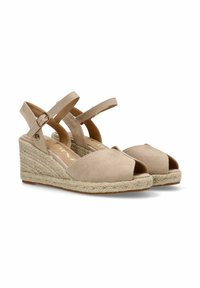 Cuñas de esparto beige con punta abierta, parte superior de ante texturizado, correas cruzadas ajustables y una entresuela de yute trenzado. Suela de goma plana.