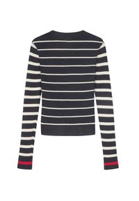 Jersey de rayas en azul marino y crema con cuello redondo, silueta ajustada, acento rojo en los puños de las mangas y mangas largas.