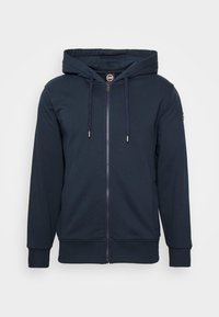 Námořnická modrá mikina na zip vyrobená z měkké tkaniny, s předním zipem, nastavitelnou kapucí na šňůrku a žebrovanými manžetami a lemem.