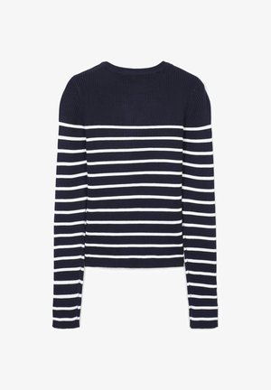 Top a maniche lunghe rigato presenta strisce orizzontali blu navy e bianche. Collo a giro, design aderente e dettagli con spacchi laterali all'orlo.