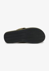 Chancla verde con una suela de goma negra texturizada, que presenta un patrón en zigzag para mayor agarre y un diseño superior minimalista y liso.