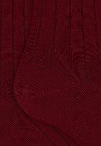 Burgundy ribbed socks featuring a soft texture and a snug fit, designed for comfort and warmth, with no visible branding or patterns.