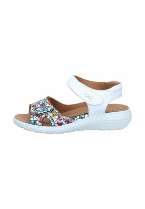 Open-toe sandal with white sole, white adjustable ankle strap, and multicolored floral pattern on front strap.