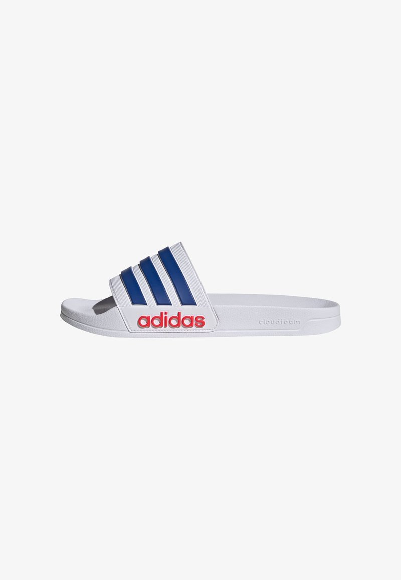 White slide sandal with three blue stripes across the top, red "adidas" logo, textured upper, and cushioned outsole labeled "cloudfoam."