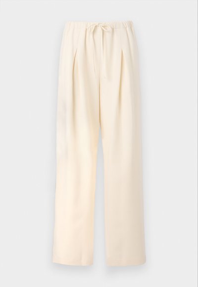 Gaišbeige plises šorti ar elastīgu jostasvietu un regulējamu šņorīti. Viegls audums un plats, taisns kāju dizains.