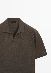 Brown short-sleeve knit polo shirt with open collar and brand label at the neckline against white background.